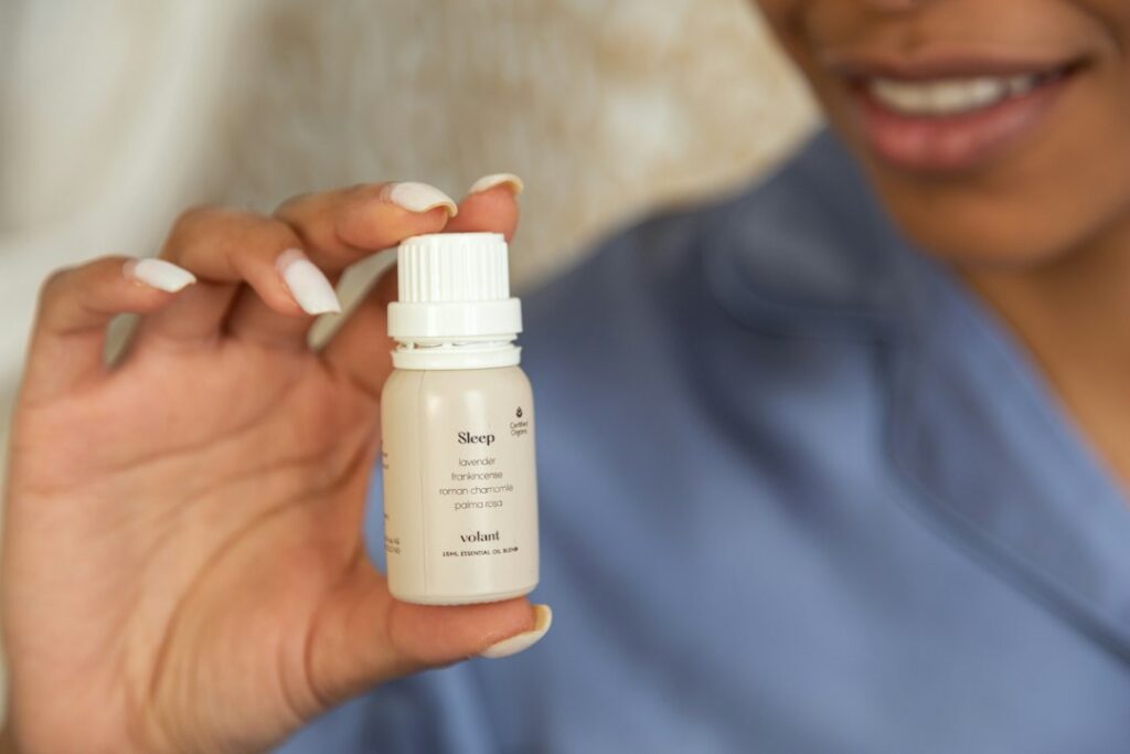 a close up of a person holding a bottle