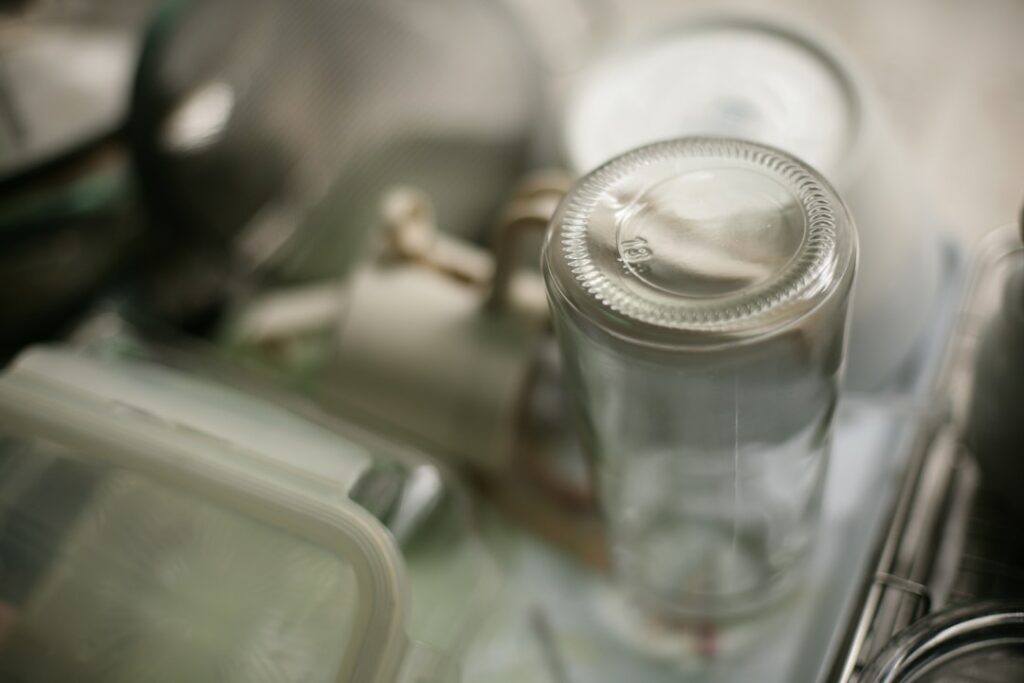 Close-up of an empty glass bottle on a shelf